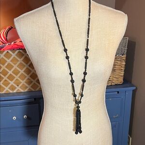 Black beads. Possibly vintage.